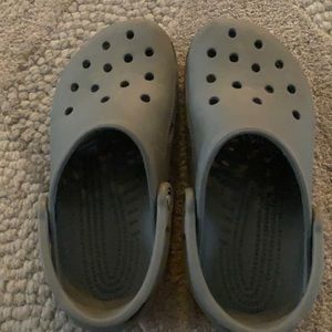 This is a croc and has a great color of grey and is size 6.